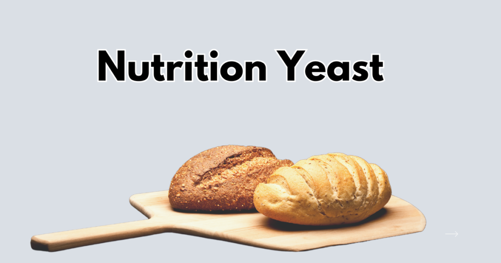 Two loaves of bread, one white and one whole wheat, sitting on a wooden pizza peel. The text "Nutrition Yeast" is displayed above.